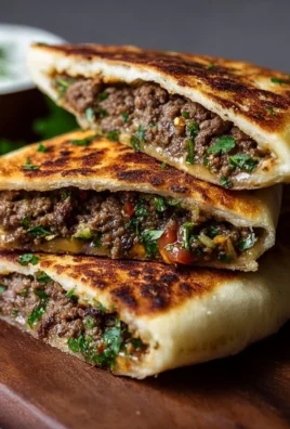 Arayes Lebanese stuffed pita filled with spiced ground meat and herbs