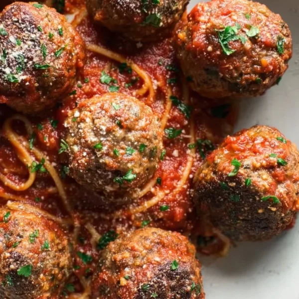 Delicious baked Italian meatballs served in a tomato sauce