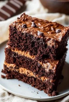 Delicious homemade brownie cake topped with chocolate frosting and sprinkles.