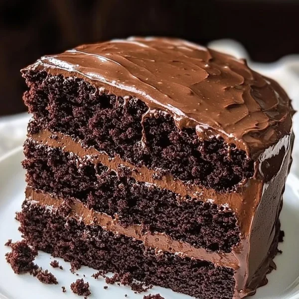 Decadent homemade chocolate cake with rich frosting and chocolate shavings