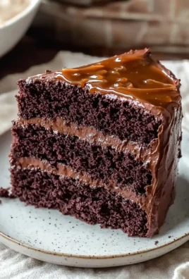 Delicious homemade Chocolate Fudge Cake topped with rich chocolate ganache