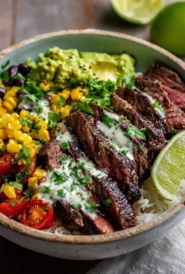 Delicious Cilantro Lime Steak Bowls garnished with fresh cilantro and lime.