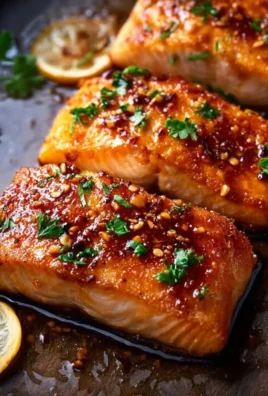 Crispy honey garlic glazed salmon on a plate with vegetables
