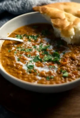 Bowl of flavorful curry lentil soup with vibrant spices and herbs