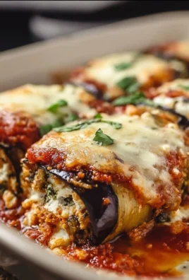 Fluffy eggplant rollatini bake topped with marinara sauce and cheese