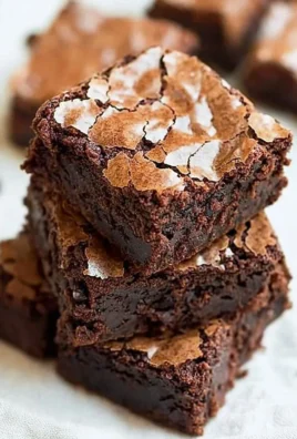 Delicious fudgy brownies with a crackly top, perfect dessert treat.