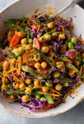 Colorful Thai chickpea salad with fresh vegetables and herbs