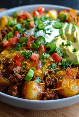 Loaded Potato Taco Bowl topped with fresh ingredients and spices