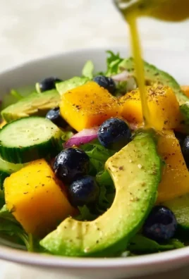 Mango Cucumber Salad with Blueberry and Avocado in a colorful bowl