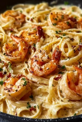 Creamy Marry Me Shrimp Pasta served in a bowl with garnishes