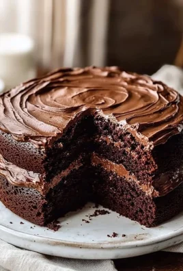 Delicious Matilda's Chocolate Cake topped with rich chocolate frosting.
