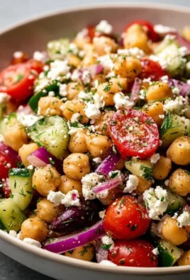 Mediterranean Chickpea Feta Salad with fresh vegetables and herbs