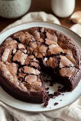 Moist chocolate cake recipe with rich frosting and a slice served on a plate