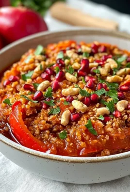 Bowl of muhammara, a flavorful Syrian dip made from red peppers and walnuts.