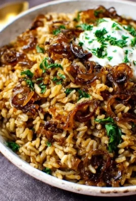 Plate of authentic Mujadara with lentils, rice, and caramelized onions.