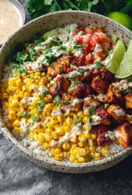 Street corn chicken rice bowl with fresh ingredients and vibrant toppings