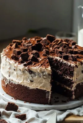 Delicious ultimate brownie cake with rich chocolate frosting and toppings