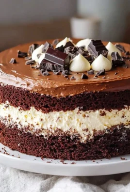 Deliciously layered tuxedo cake with chocolate and vanilla frosting