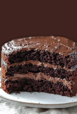 Ultimate decadent gluten free chocolate cake with rich, creamy frosting