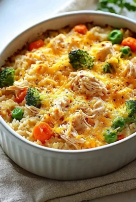 Delicious rotisserie chicken casserole topped with cheese and herbs