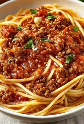 Spaghetti topped with rich meat sauce for a comforting Italian meal.