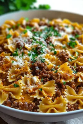 Cajun Cream Cheese Alfredo Bowties with Spiced Ground Beef dish served on a plate