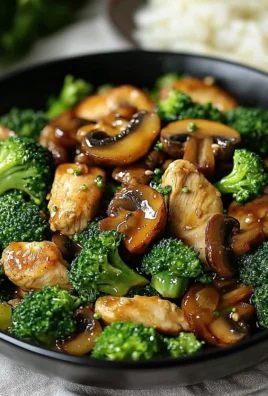 A vibrant Chicken, Broccoli & Mushroom Stir-Fry served in a bowl