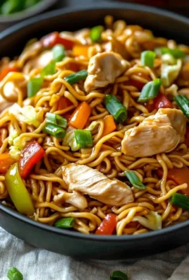 Delicious Chicken Chow Mein served with colorful vegetables and tender chicken