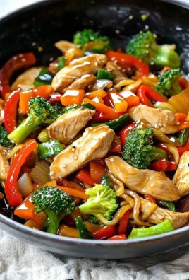 Colorful Chicken Stir Fry with vegetables and sauce in a bowl