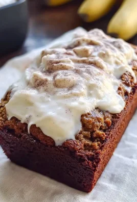 Freshly baked Cinnamon Roll Banana Bread with cinnamon swirl topping