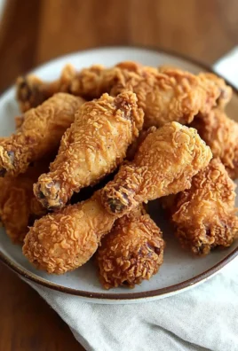 Plate of Copy Cat KFC Fried Chicken with crispy golden coating