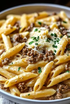 Creamy beef pasta topped with herbs and cheese