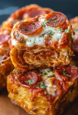 High protein pepperoni pizza rolls on a plate, ready to eat.
