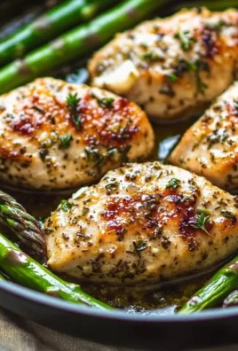 One Pan Garlic Herb Chicken served with fresh asparagus and herbs