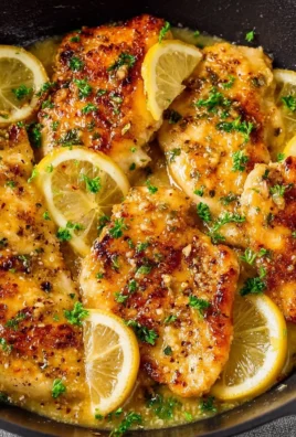 Plate of quick and easy lemon chicken garnished with herbs