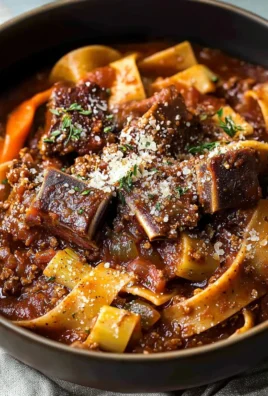 Delicious short rib ragu served with pasta in a rustic bowl