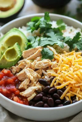Slow cooker chicken burrito bowl with rice, beans, and fresh toppings