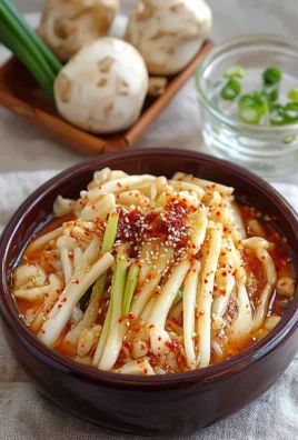 Delicious spicy enoki mushrooms served in a colorful dish