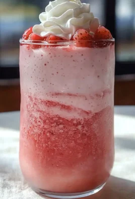Starbucks strawberry cream frappuccino with whipped cream and strawberry drizzle