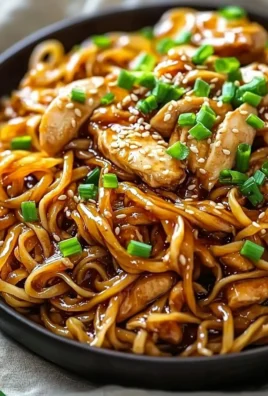 Delicious Sticky Garlic Chicken Noodles with vibrant vegetables