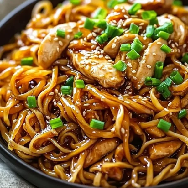 Delicious Sticky Garlic Chicken Noodles with vibrant vegetables