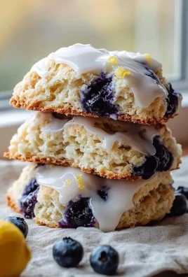 Bakery-style blueberry lemon scones on a cooling rack
