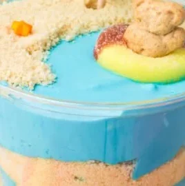 Beach Cheesecake Pudding Cups in clear dessert cups with graham cracker crust
