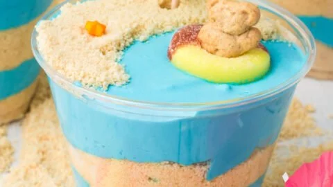 Beach Cheesecake Pudding Cups in clear dessert cups with graham cracker crust