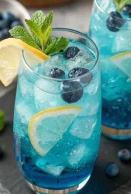 Blue Lagoon non-alcoholic drink served in a glass with a garnish