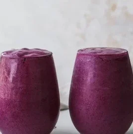 Blueberry avocado smoothie with lemon and yogurt served in a glass