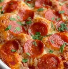 Delicious Bubble Up Biscuit Pizza Casserole with melted cheese and pepperoni