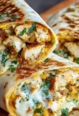 Delicious cheesy garlic chicken wraps with fresh ingredients and melted cheese.