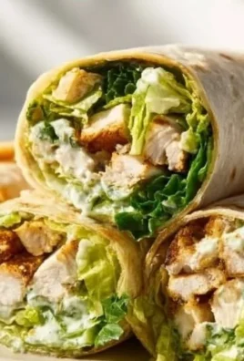 Delicious Chicken Caesar Wraps served with fresh ingredients and Caesar dressing.