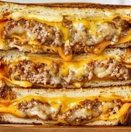 Classic patty melt with grilled onions and cheese on toasted bread